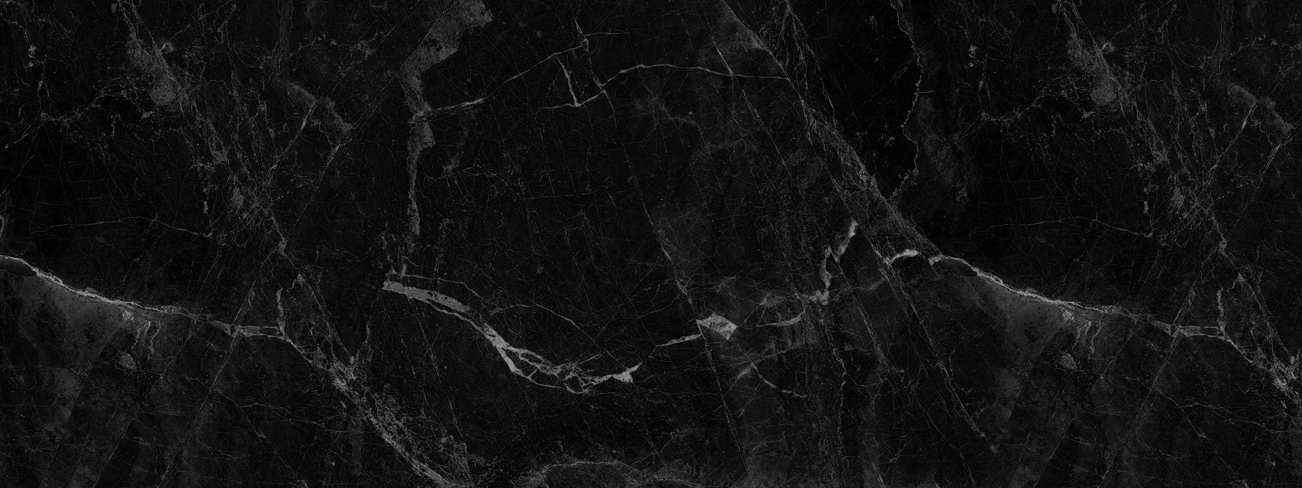 Black marble texture with light veining patterns.