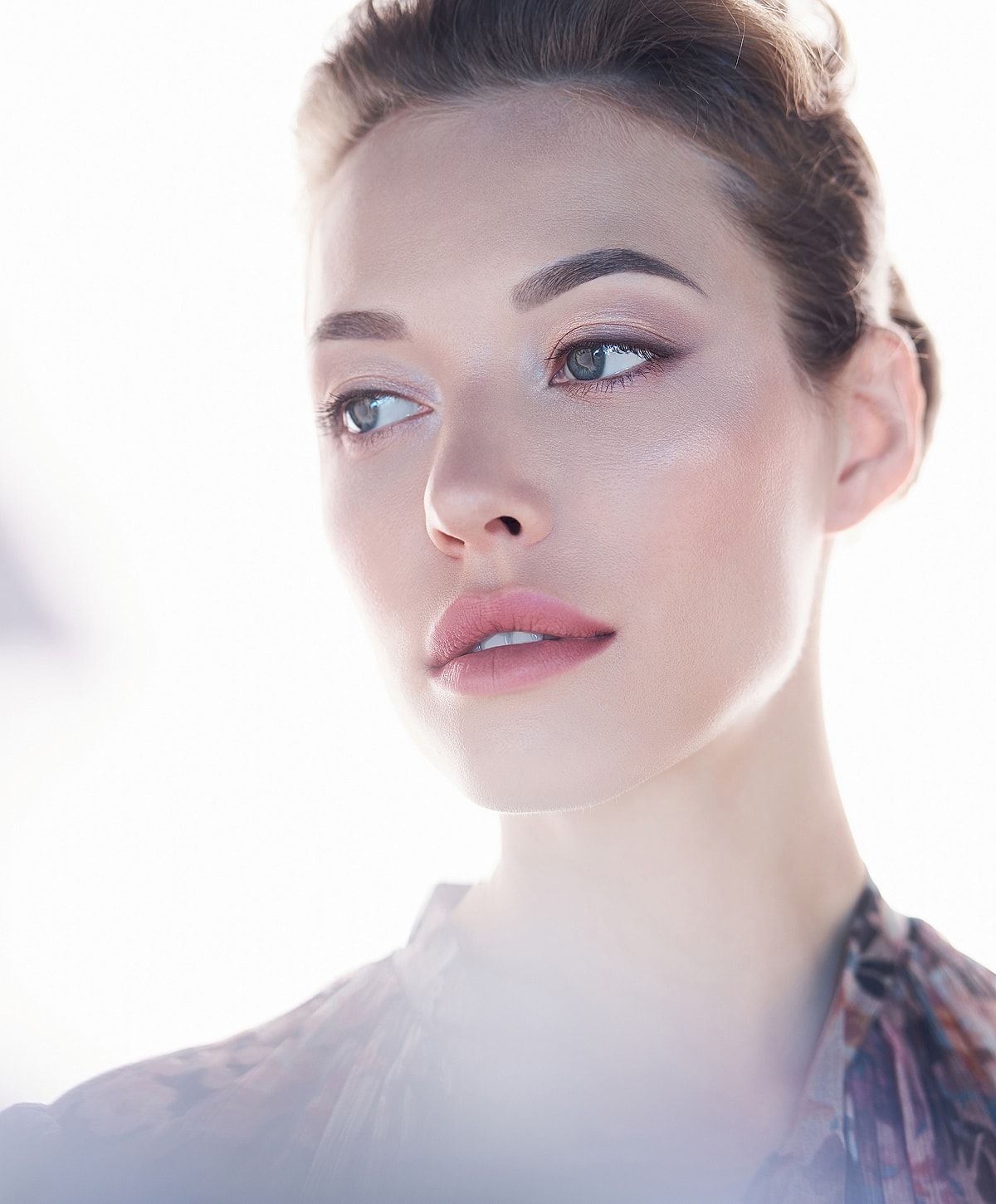 Close-up of a woman with soft makeup.